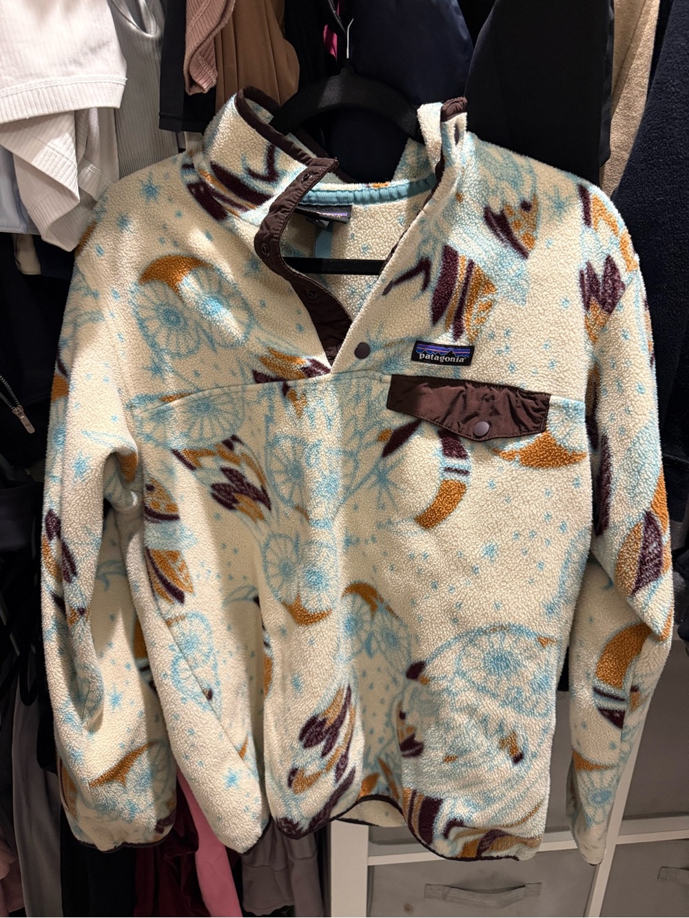 Patagonia women’s Cream Fleece Snap-Front Pullover with Blue & Brown Print